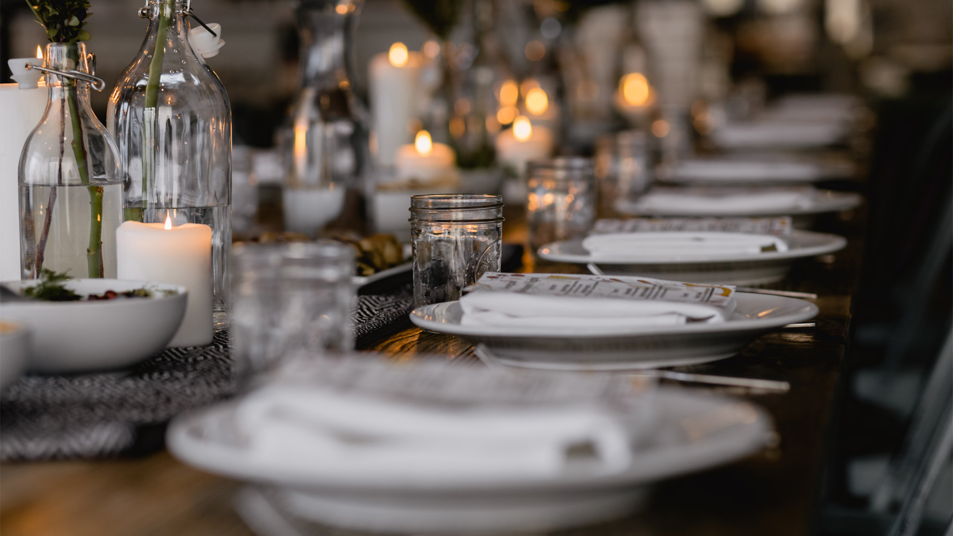 decorative: dinner table with glasses and plates on it