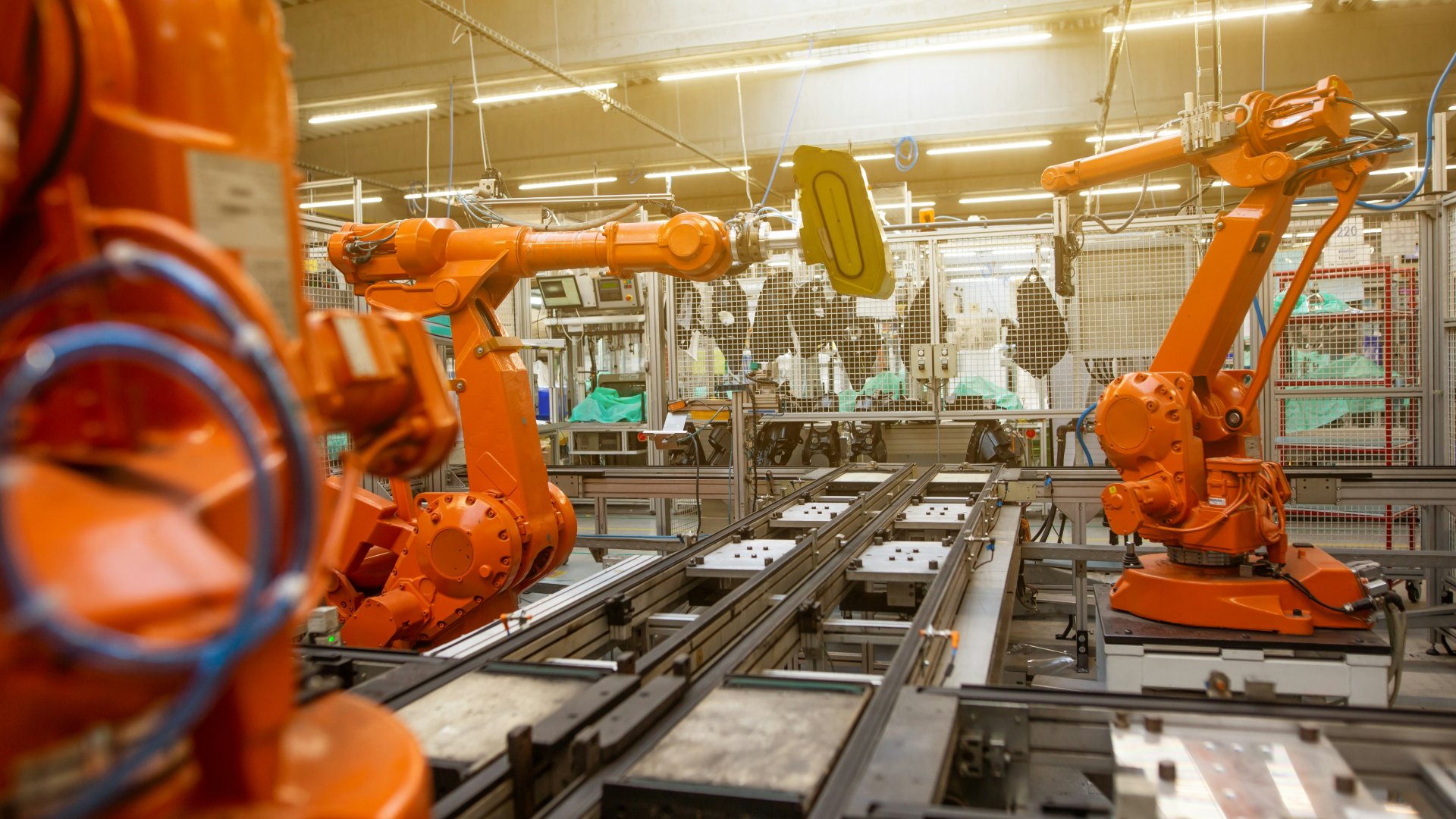 A factory filled with lots of orange machines