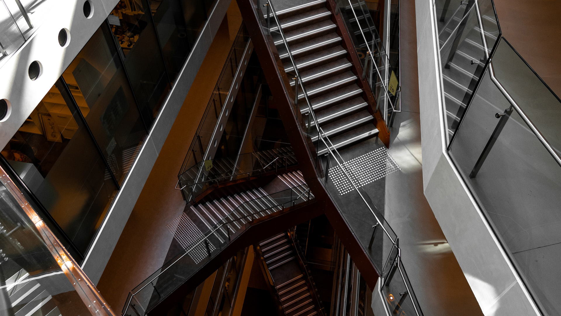decorative image: staircases in a modern building overlapping